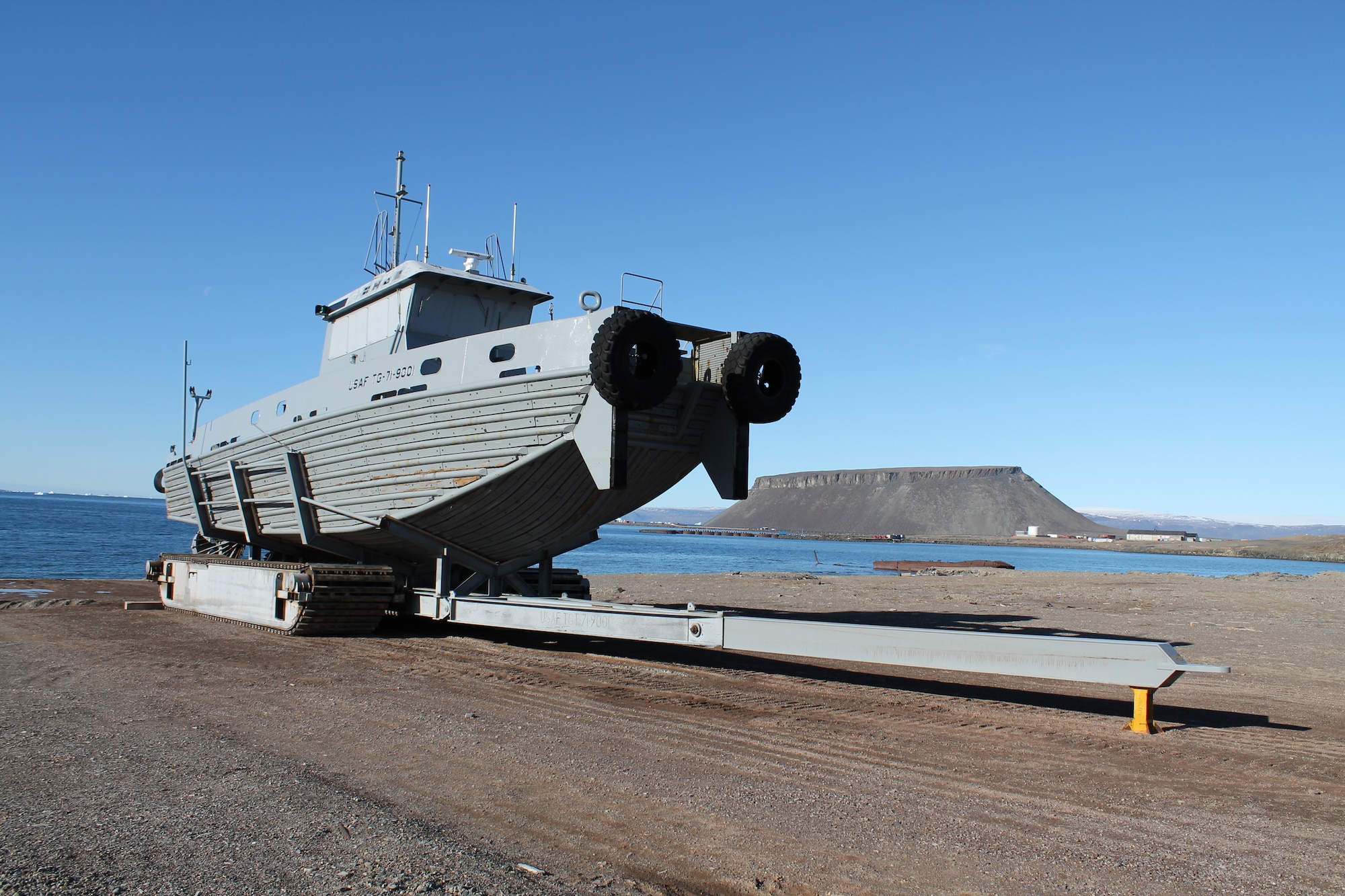 THULE AIR BASE, Greenland -- At the end of the brief summer, the 71-foot tugboat “Rising Star” is pulled out of the frigid water on a tracked trailer and stored on the North Star Bay beach. (U.S. Air Force photo)