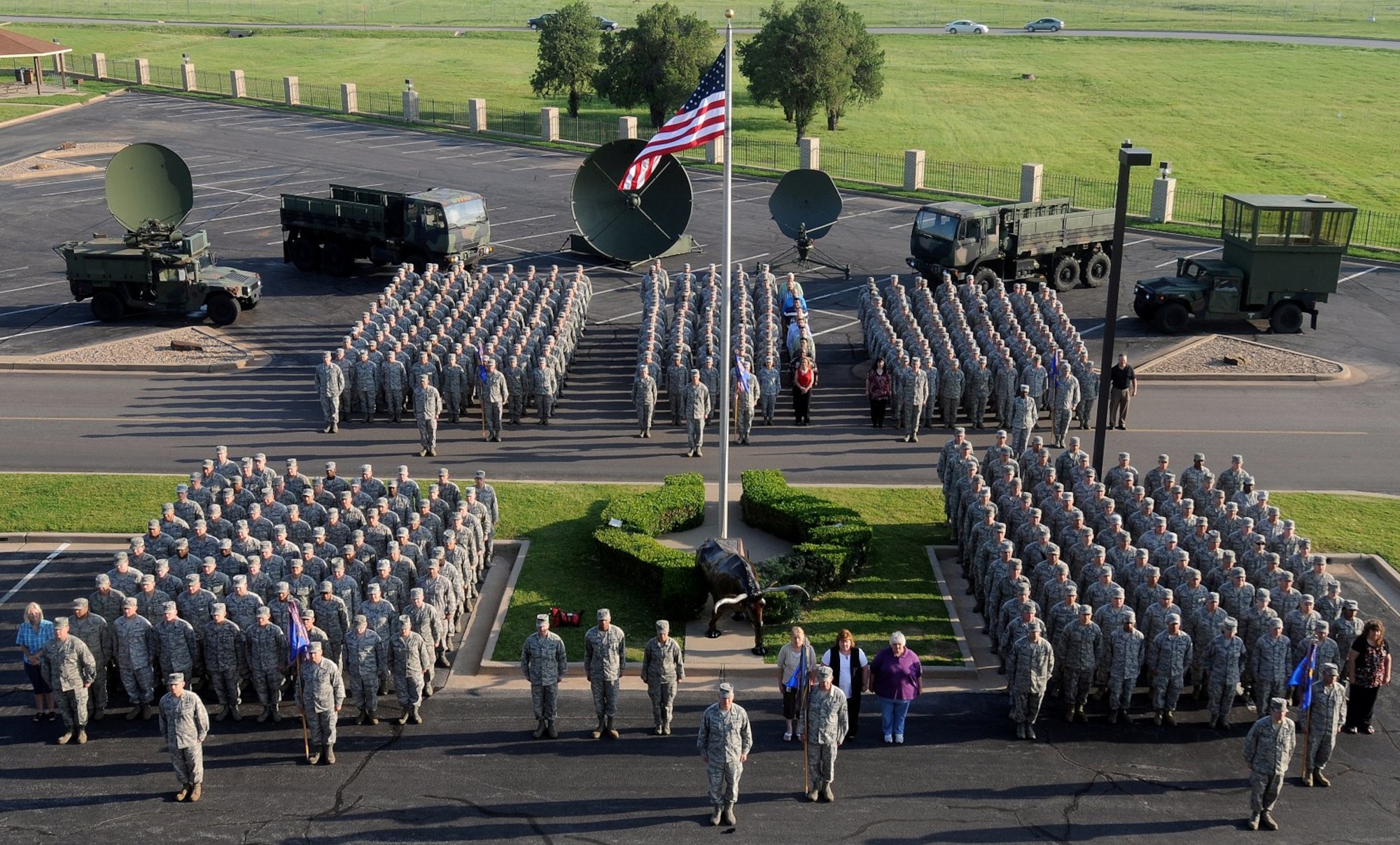 Members of the 3rd Combat Communications Group stand in formation at Tinker Air Force Base, Okla. The 3rd CCG was officially inactivated Sept. 30, along with the 689th Combat Communications Wing at Robins Air Force Base, Ga.  (U.S. Air Force courtesy photo)