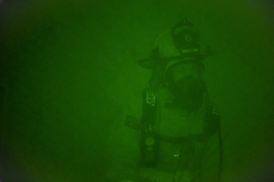 U.S. Air Force firefighters from the 165th Airlift Wing, Georgia Air National Guard search for simulated victims in a smoke filled building Sept. 15, 2013 at Savannah Air National Guard Base in Garden City, Ga. The base fire department also responds to calls from Savannah/Hilton Head International Airport and Gulfstream Aerospace. (National Guard photo by Staff Sgt. Noel Velez-Crespo/released)