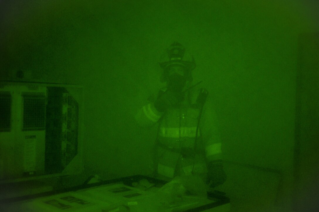 U.S. Air Force firefighters from the 165th Airlift Wing, Georgia Air National Guard search for simulated victims in a smoke filled building Sept. 15, 2013 at Savannah Air National Guard Base in Garden City, Ga. The base fire department also responds to calls from Savannah/Hilton Head International Airport and Gulfstream Aerospace. (National Guard photo by Staff Sgt. Noel Velez-Crespo/released)