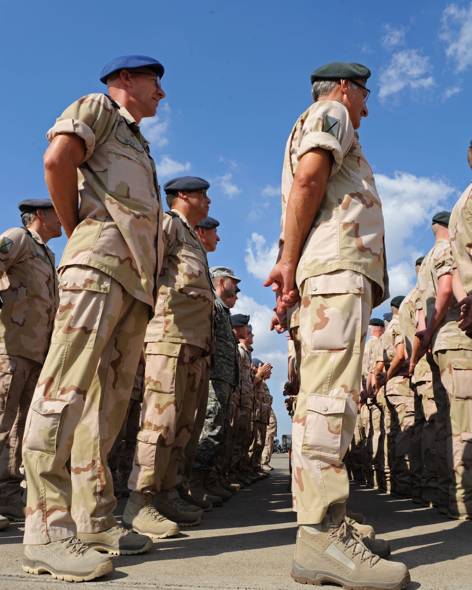 1st Netherlands Ballistic Missile Defense Task Force Dutch soldiers stand in formation around U.S. Army Capt. Adam Proctor, 1st NBMDTF missile systems tactical director Sept. 27, 2013, at Incirlik Air Base, Turkey. Proctor is currently deployed to Turkey with the Dutch military as a foreign exchange officer. (U.S. Air Force photo by Senior Airman Chase Hedrick/Released)