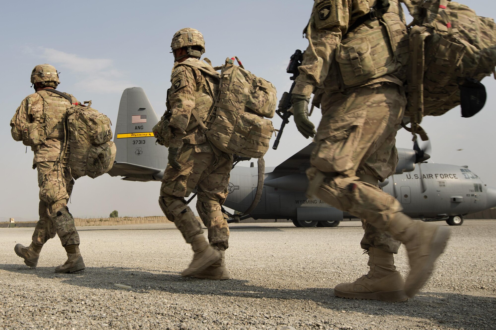 Army 101st Airborne Division Soldiers make their way to a 774th Expeditionary Airlift Squadron C-130 Hercules cargo plane at Forward Operating Base Salerno, Khost province, Afghanistan, Sept. 23, 2013. The 19th Movement Control Team, a small squadron of Air Force surface movement controllers and aerial porters, have the herculean task of overseeing the vast majority of retrograde operations at FOB Salerno. (USAF Photo/Master Sgt. Ben Bloker)



