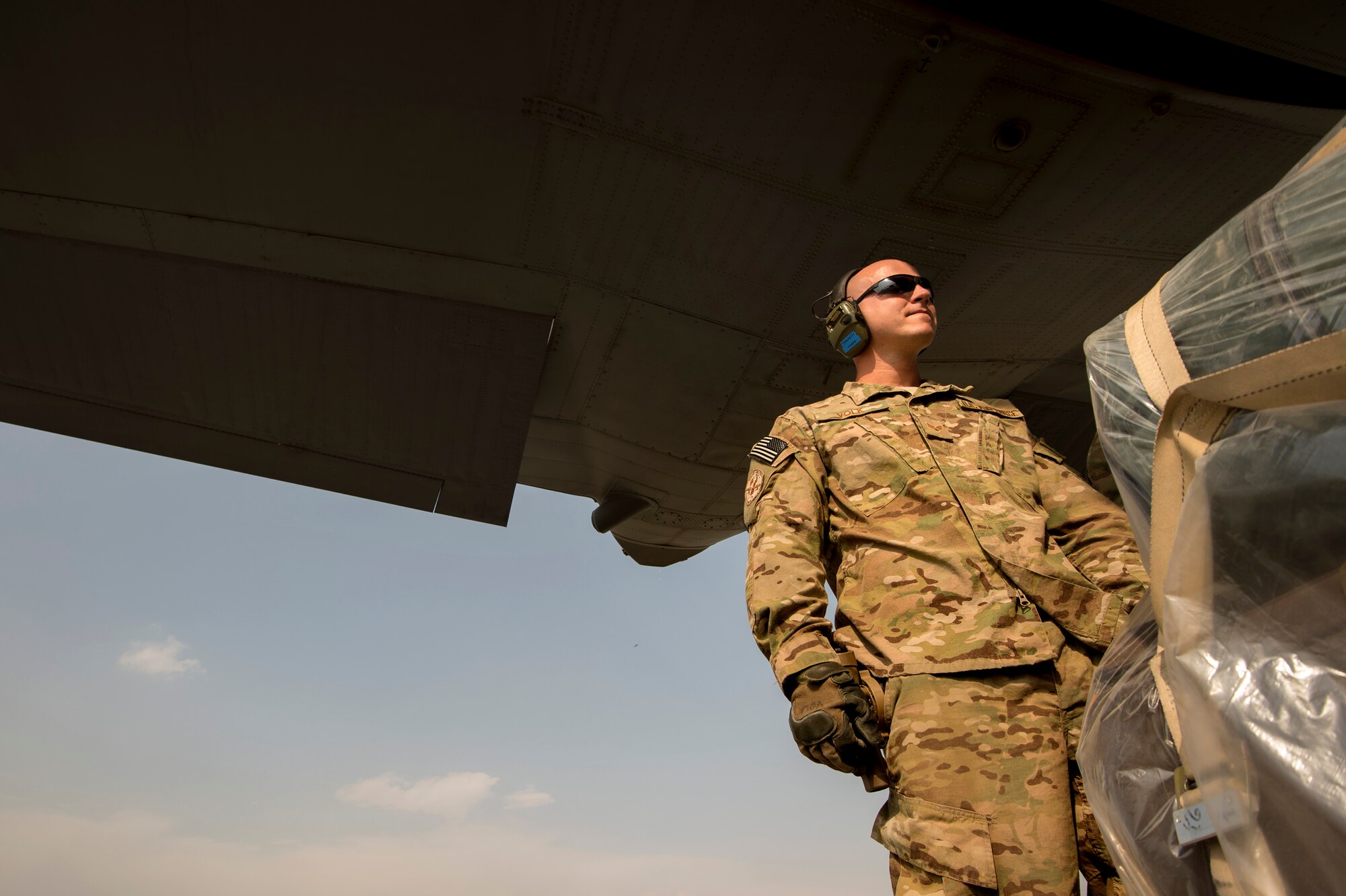 Senior Airman Matthew Volk, 19th Movement Control Team aerial porter, prepares for a 774th Expeditionary Airlift Squadron C-130 Hercules pallet transfer at Forward Operating Base Salerno, Khost province, Afghanistan, Sept. 23, 2013. The 19th MCT, a small squadron of Air Force surface movement controllers and aerial porters, have the herculean task of overseeing the vast majority of retrograde operations at FOB Salerno. Volk, a Lousburg, Tenn. native is forward deployed from Ramstein Air Base, Germany. (USAF Photo/Master Sgt. Ben Bloker)


