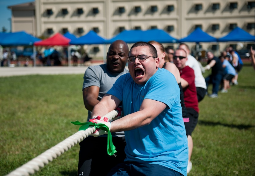 Airmen from the 8th Mission Support Group compete in a tug-of-war match during Korean and American Friendship Day at Kunsan Air Base, Republic of Korea, Sept. 27, 2013. The 8th MSG team beat the ROK air force team in this event, which was one of several activities held throughout the day to build camaraderie and partnership. (U.S. Air Force photo by Senior Airman Clayton Lenhardt/Released)