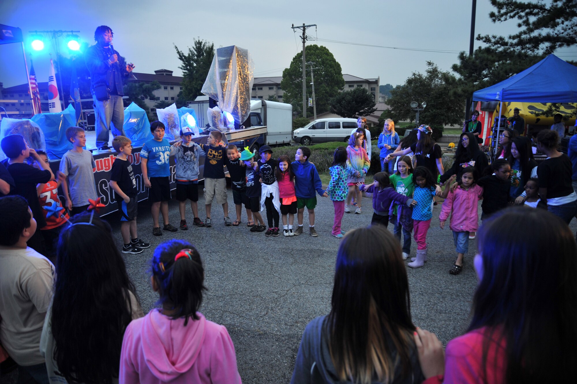 Osan children prepare to perform the chicken dance during Oktoberfest at Osan Air Base, Republic of Korea, Sept. 28, 2013. The four-hour event featured a multitude of entertainment provided by the 51st Force Support Squadron. (U.S. Air Force photo/Staff Sgt. Emerson Nuñez)