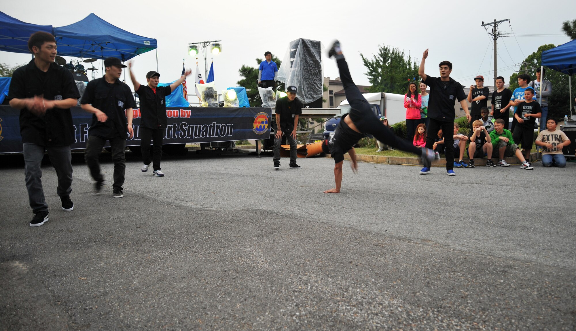 Break dancers perform during Oktoberfest at Osan Air Base, Republic of Korea, Sept. 28, 2013. The 51st Force Support Squadron provided events for Osan residents and guest of all ages. (U.S. Air Force photo/Staff Sgt. Emerson Nuñez)