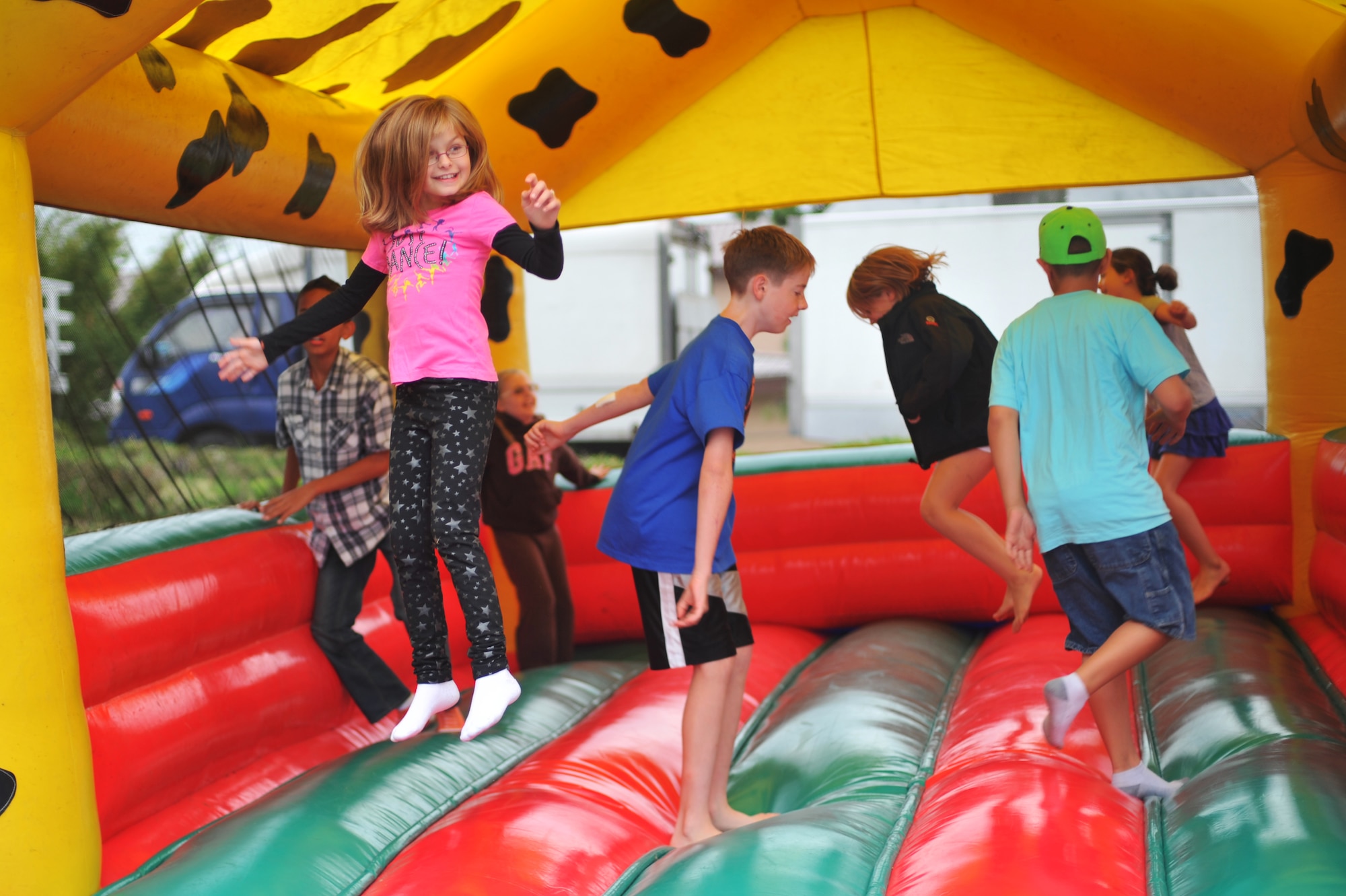 Osan children jump in a bouncy castle during Oktoberfest at Osan Air Base, Republic of Korea, Sept. 28, 2013. The 51st Force Support Squadron provided events for Osan residents and their guest of all ages. (U.S. Air Force photo/Staff Sgt. Emerson Nuñez)