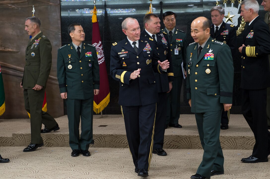 U.S. Army Gen. Martin E. Dempsey, chairman of the Joint Chiefs of Staff, talks with South Korean Gen. Jung Seung-Jo, South Korean chairman of the Joint Chiefs of Staff, during an office call in Seoul, South Korea, Sept. 30, 2013. 