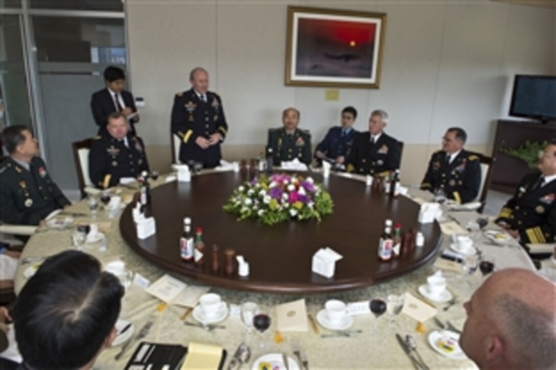 U.S. Army Gen. Martin E. Dempsey, center standing, chairman of the Joint Chiefs of Staff, talks with senior military leaders during the 38th Military Committee Meeting in Seoul, South Korea, Sept. 30, 2013.