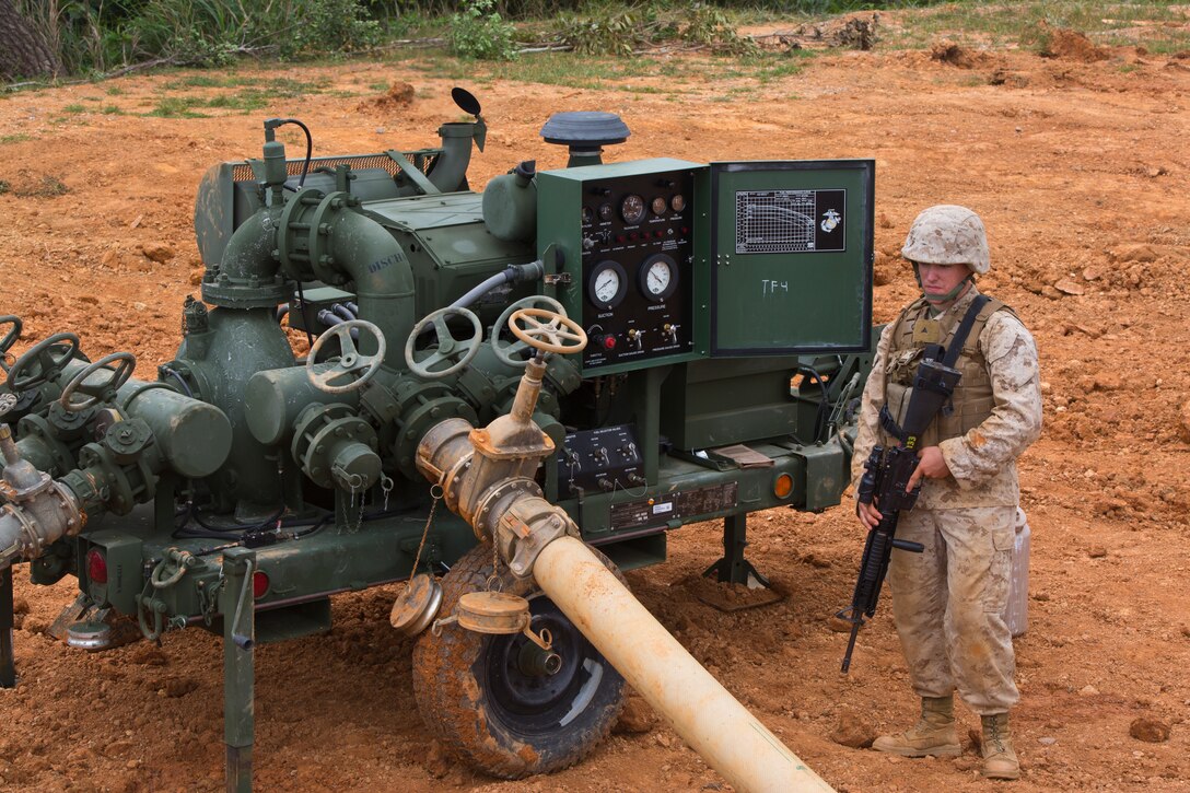 Lance Cpl. Jordan C. Caserta operates a fuel pump at Landing Zone Hawk in the Central Training Area March 27 during a field training exercise. Pump operators ensure the 600-gallon-per-minute pump functions properly while maintaining security. Caserta is a bulk fuel specialist with Bulk Fuel Company, 9th Engineer Support Battalion, 3rd Marine Logistics Group, III Marine Expeditionary Force. 