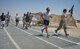 Service members kick off a 24-hour Tactical Air Control Party remembrance run at Al Udeid Air Base, Qatar, March 27, 2014. The event was held to ensure those warriors who have made the ultimate sacrifice are never forgotten. This year’s 24-hour TACP challenge was the third annual event dedicated to the 10 fallen TACP warriors who were killed in combat and training operations within the last 20 years. The event was held world-wide with every TACP unit starting the run March 27 at noon local time. (U.S. Air Force photo/Senior Airman Jared Trimarchi) 

