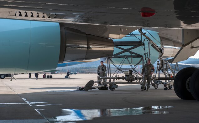 Senior Airman Stephen Crowley, 86th Logistics Readiness Squadron fuels distribution operator, and Senior Master Sgt. Moore, 86th LRG, take part in the refueling procedures of Air Force One, March 29, 2014, at Ramstein Air Base, Germany. During President Barack Obama’s stop, he visited wounded warriors from Landstuhl Regional Medical Center. (U.S. Air Force photo/Senior Airman Damon Kasberg) 

