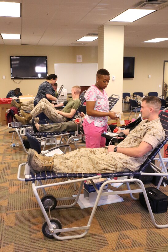 Marines and civilians give blood at Yale Hall on March 24, 2014. Headquarters and Service Bn. hosted the event to collect blood that could be in Afghanistan to help fellow service members within a week. 