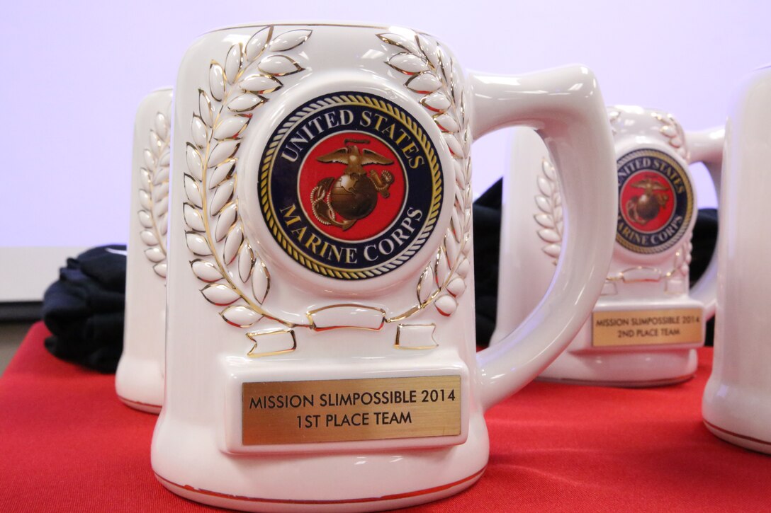 Mugs sit atop a table at the Barber Physical Activities Center aboard Marine Corps Base Quantico on March 26, 2014. The mugs were given as gifts to the first and second place winners of the 2014 SlimPossible program. 
