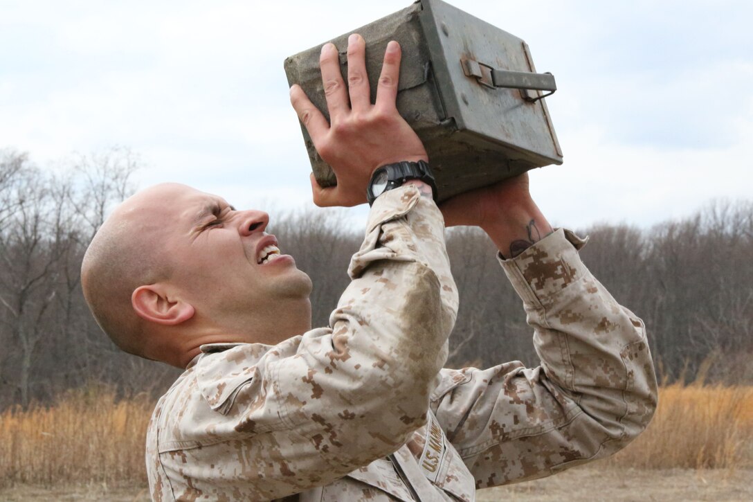 Gunnery Sgt. Mario Jacobo lifts an ammo can during a combat conditioning station aboard Marine Corps Base Quantico on March 28, 2014. The challenge was part of an eight-station training event that Headquarters and Service Co. Marines participated in. 