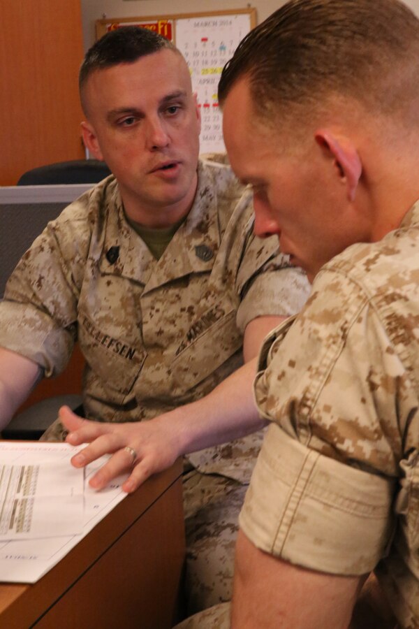 Gunnery Sgt. David Tellefsen, enlisted career counselor, talks with a Marine aboard Marine Corps Base Quantico on March 25, 2014. The five Quantico counselors are the only Marines in their capacity to serve every active duty enlisted Marine, sergeant and above, Marine Corps-wide.