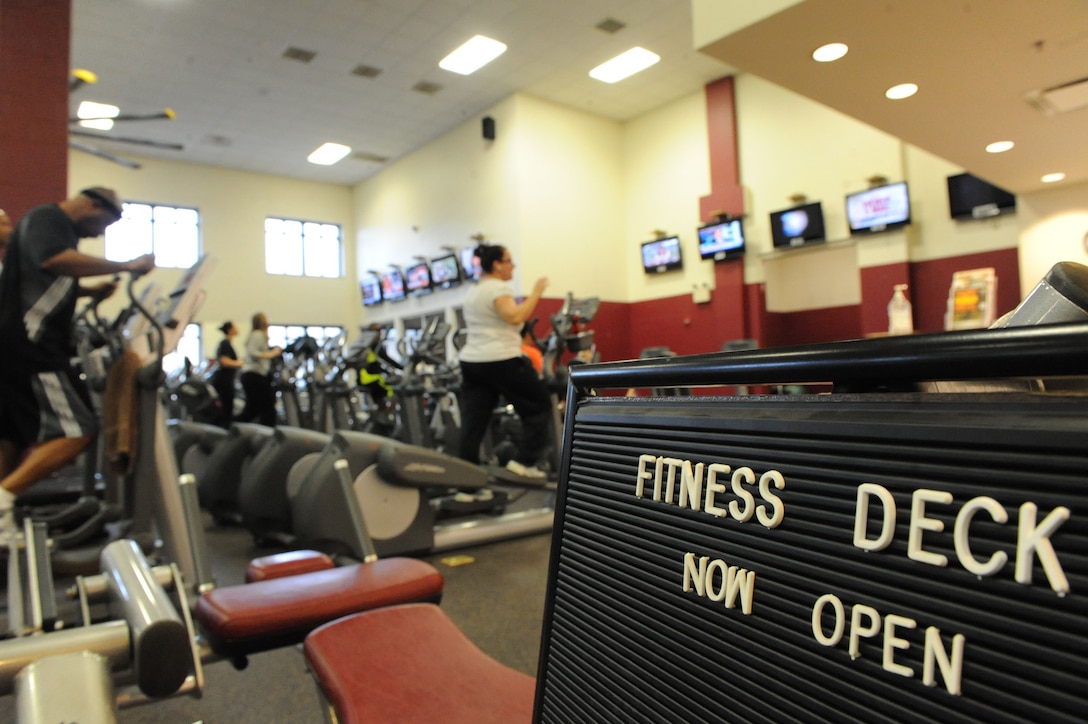 Patrons of the Barber Physical Activities Center work out on January 4, 2012. The gym has three challenges where leaders have their names posted on challenge leader boards.