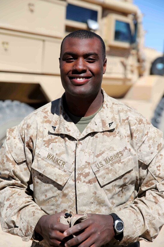 Lance Cpl. Kalib Walker, an automatic rifleman with Bravo Company, 1st Battalion, 7th Marine Regiment, and a native of Freeport, N.Y., departed the United States for his second tour to Afghanistan ten days prior to the birth of his first child, Kylie. Walker had been training for his current deployment when his wife, Mariolbis, became pregnant. Since his arrival in Afghanistan, he has been able to occasionally visually contact his wife and child through video messaging. (U.S. Marine Corps photo by Cpl. Joseph Scanlan / released)
