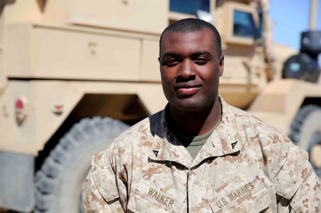 Lance Cpl. Kalib Walker, an automatic rifleman with Bravo Company, 1st Battalion, 7th Marine Regiment, and a native of Freeport, N.Y., departed the United States for his second tour to Afghanistan ten days prior to the birth of his first child, Kylie. Walker had been training for his current deployment when his wife, Mariolbis, became pregnant. Since his arrival in Afghanistan, he has been able to occasionally visually contact his wife and child through video messaging. (U.S. Marine Corps photo by Cpl. Joseph Scanlan / released)