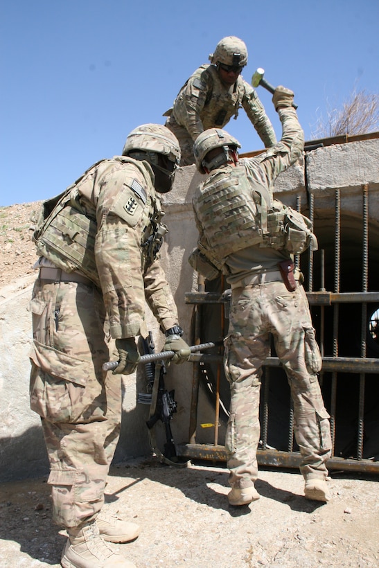 Coalition forces install culvert denial systems to prevent IED placement