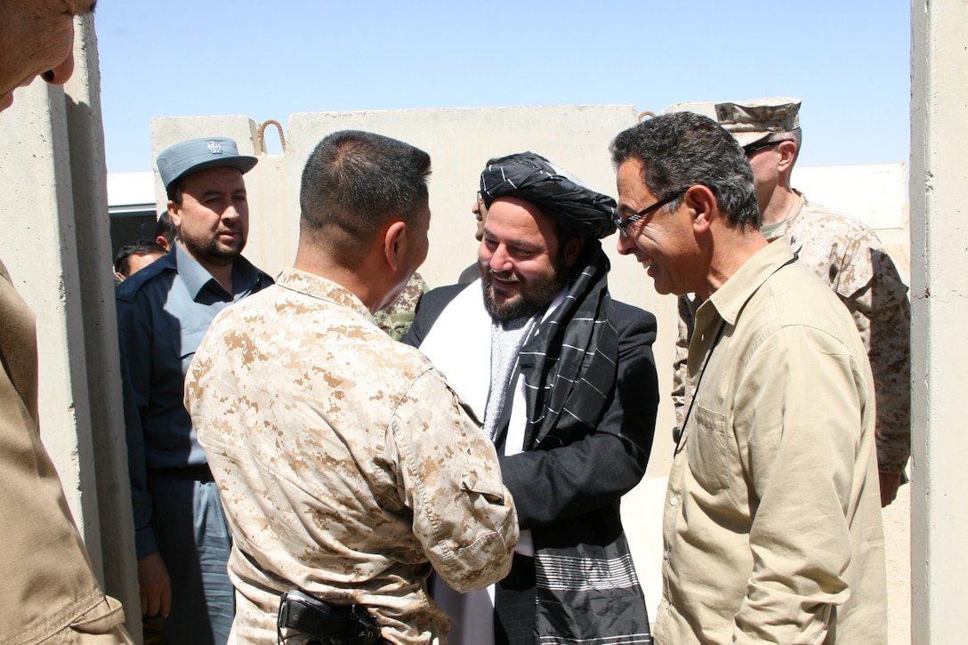 Brigadier Gen. Daniel D. Yoo, commanding general, Regional Command (Southwest), greets Amir Mohammad Akhundzada, Nimroz provincial governor, aboard Camp Leatherneck, Helmand province, Afghanistan, March 29, 2014. Brigadier Gen. Yoo, Marine Expeditionary Brigade - Afghanistan staff, Afghan National Army officials as well as the Helmand provincial chief of police, met during a regional security shura held to discuss the upcoming presidential elections and security measures being emplaced to ensure the local people are kept safe.