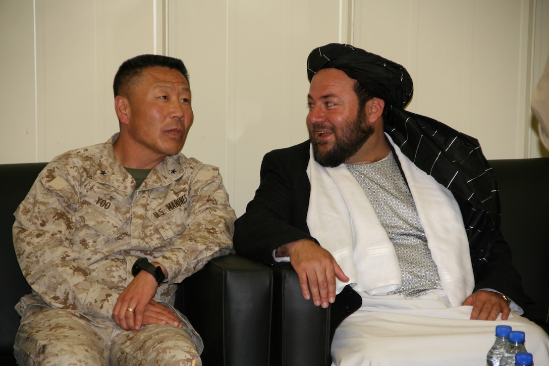 Brigadier Gen. Daniel D. Yoo, left, commanding general, Regional Command (Southwest), talks with Amir Mohammad Akhundzada, Nimroz provincial governor, aboard Camp Leatherneck, Helmand province, Afghanistan, March 29, 2014. Brigadier Gen. Yoo, Marine Expeditionary Brigade - Afghanistan staff, Afghan National Army officials as well as the Helmand provincial chief of police, met during a regional security shura held to discuss the upcoming presidential elections and security measures being emplaced to ensure the local people are kept safe.