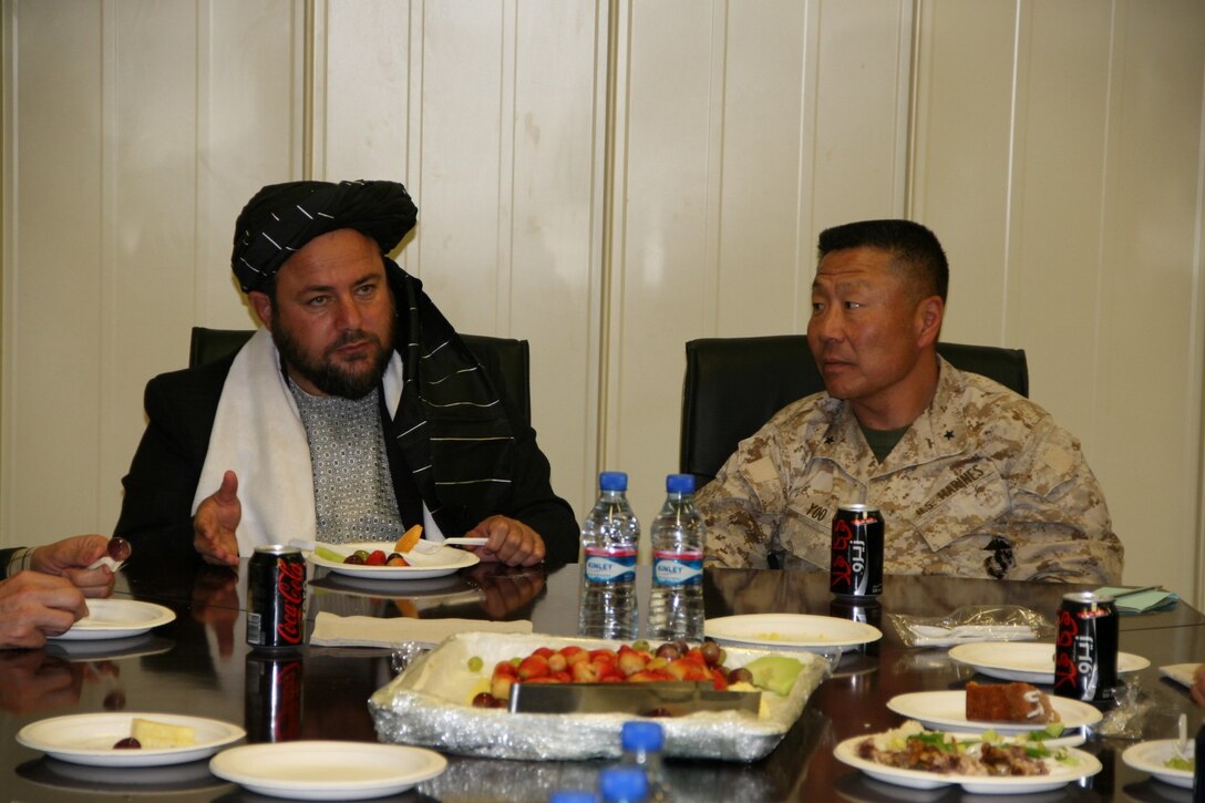 Brigadier Gen. Daniel D. Yoo, right, commanding general, Regional Command (Southwest), talks with Amir Mohammad Akhundzada, Nimroz provincial governor, aboard Camp Leatherneck, Helmand province, Afghanistan, March 29, 2014. Brigadier Gen. Yoo, Marine Expeditionary Brigade - Afghanistan staff, Afghan National Army officials as well as the Helmand provincial chief of police, met during a regional security shura held to discuss the upcoming presidential elections and security measures being emplaced to ensure the local people are kept safe.