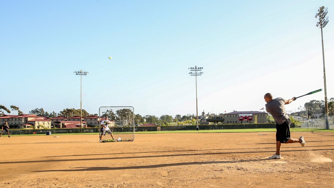 Petty Officer 2nd Class Gabriel Cisneros, religious program specialist, 15th Marine Expeditionary Unit, hits a home run during a softball practice aboard Camp Pendleton, Calif., March 13, 2014. Cisneros, 36, is from Diamond Bar, Calif.  (U.S. Marine Corps video by Cpl. Emmanuel Ramos/Released)