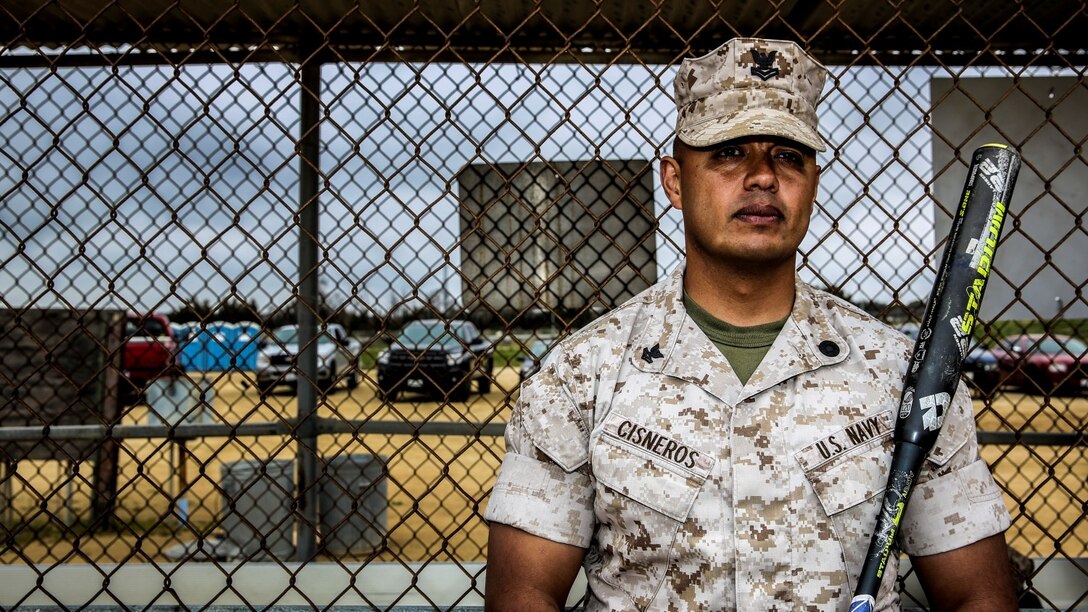 Petty Officer 2nd Class Gabriel Cisneros, religious program specialist, 15th Marine Expeditionary Unit, poses for a photo during a softball practice aboard Camp Pendleton, Calif., March 24, 2014. Cisneros, 36, is from Diamond Bar, Calif.  (U.S. Marine Corps video by Cpl. Emmanuel Ramos/Released)