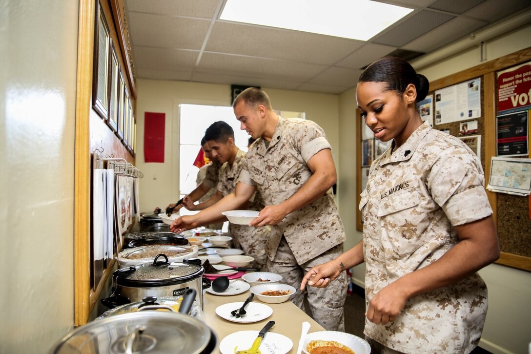 Marines with the 15th Marine Expeditionary Unit prepare their dishes of chili for the judges during the unit’s chili cook off aboard Camp Pendleton, Calif., March 27, 2014. The chili was judged on temperature, spice, presentation, texture and aftertaste. (U.S. Marine Corps photo by Cpl. Emmanuel Ramos/Released)