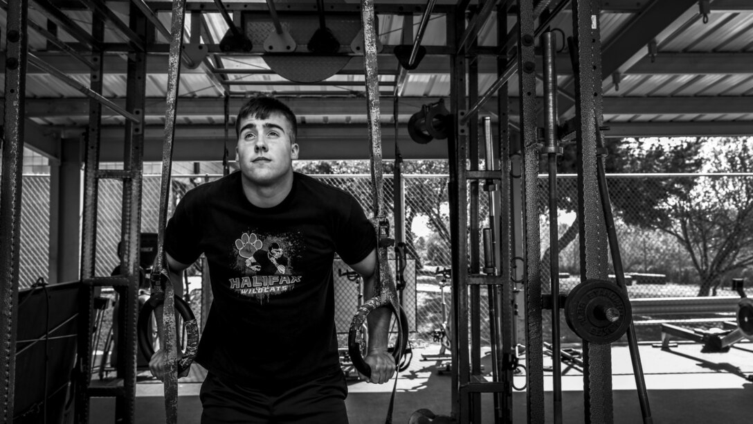 Lance Cpl. Austin Enders, intelligence specialist, 15th Marine Expeditionary Unit, works out aboard Camp Pendleton, Calif., March 27, 2014. Enders, 19, is from Halifax, Pa. and enlisted in the Marine Corps on Sept. 11, 2012 (U.S. Marine Corps photo by Cpl. Emmanuel Ramos/Released)