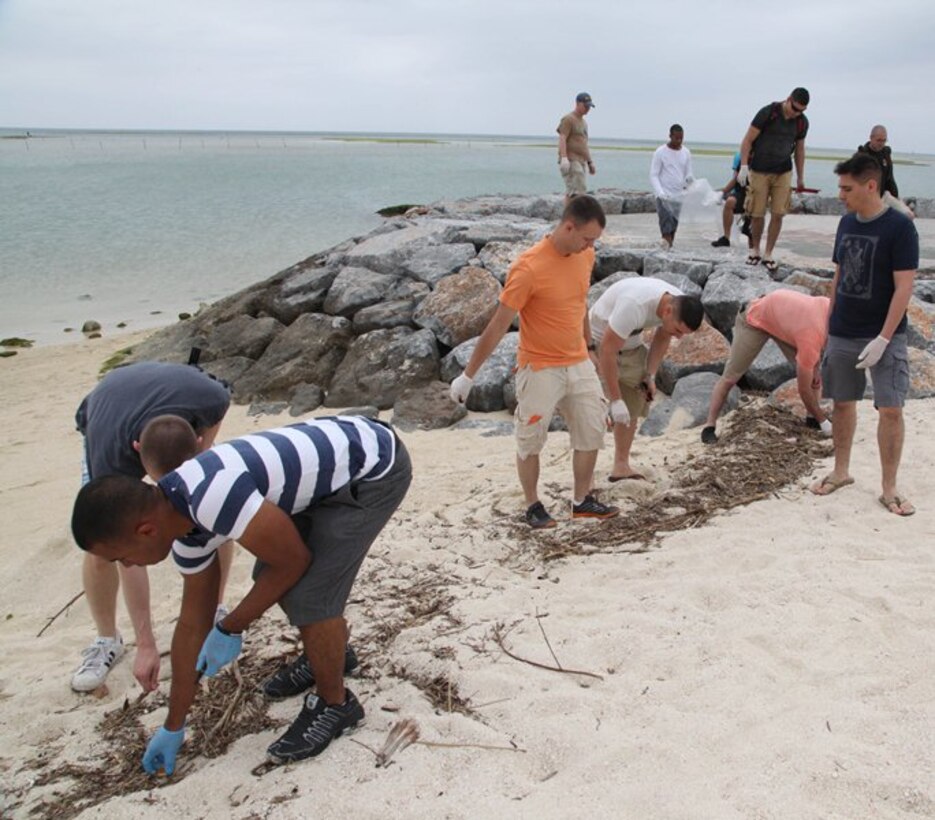 Marines pick up garbage on Araha Beach March 28 as part of a camaraderie building event. The Marines were divided into groups to cover different areas where they could cleanup trash. The Marines are with Marine Aviation Logistics Squadron 36, Marine Aircraft Group 36, 1st Marine Aircraft Wing, III Marine Expeditionary Force.