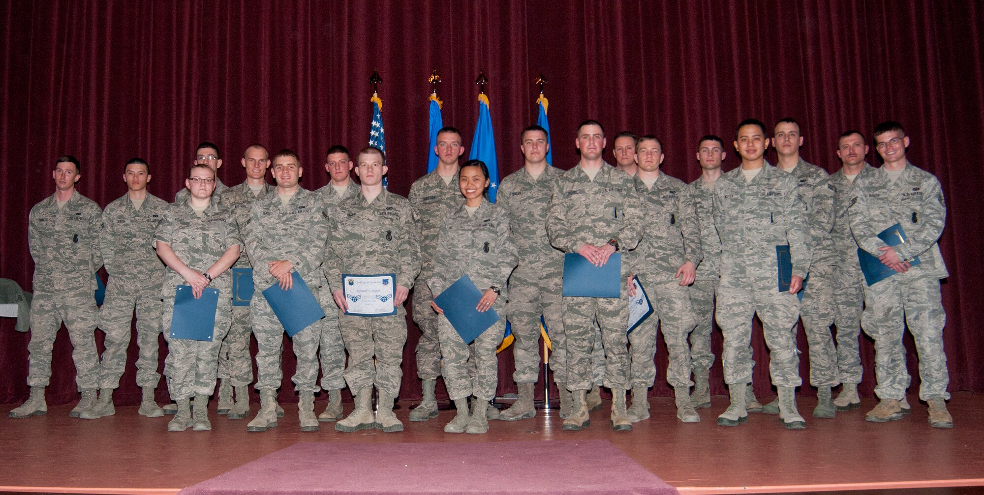 March enlisted promotees from F.E. Warren Air Force Base, Wyo., pose for a photo in the F.E. Warren base theater March 31, 2014. (U.S. Air Force photo by Airman 1st Class Jason Wiese)