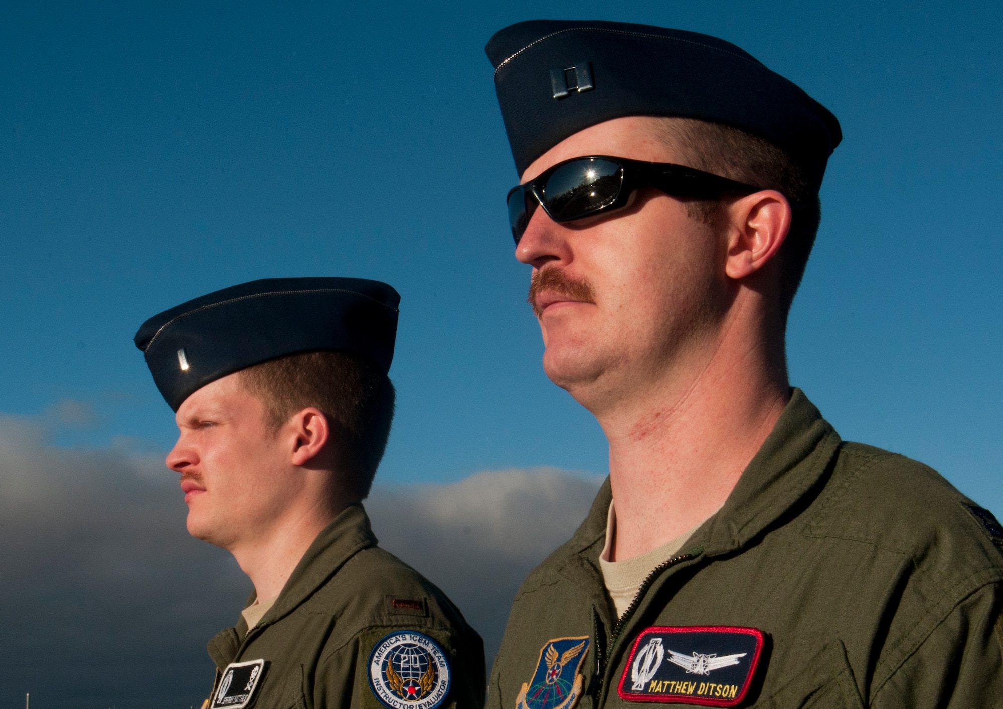 Capt. Matthew Ditson, 90th Operations Support Squadron ICBM code controller, and 2nd Lt. Jeffrey Mattheis, 90th Operations Group Standards and Evaluations deputy evaluator, display 21 days of mustache growth March 21, 2014, on F.E. Warren Air Force Base, Wyo. While mustaches do not directly contribute to nuclear deterrence, they certainly do nothing to hinder it. (U.S. Air Force photo by Airman 1st Class Jason Wiese)