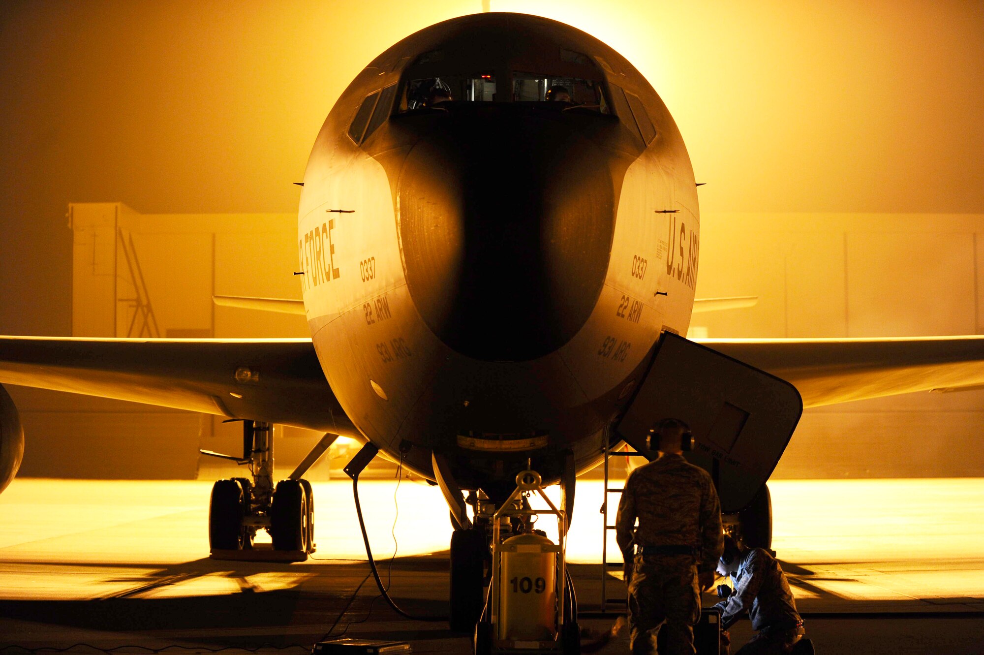 Airmen from the 22nd Aircraft Maintenance Squadron review a technical order, March 31, 2014, at McConnell Air Force Base, Kan. The Airmen were part of the swing-shift in the 22nd AMXS, who work the latter part of the day and early part of the night. (U.S. Air Force photo/Airman 1st Class Victor J. Caputo)