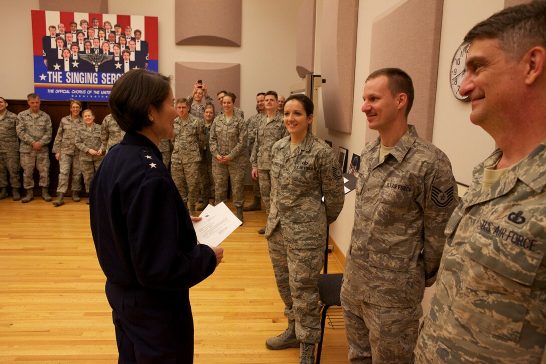 Members of the Band look on as Maj. Gen. Sharon Dunbar congratulates Senior
Master Sgt. Bob Thurston, Technical Sgt. Matthew Geist and Technical Sgt.
Emily Wellington on their recent Air Force Media Contest awards.  (U.S. Air
Force photo by Master Sgt. Matthew Irish/released)
