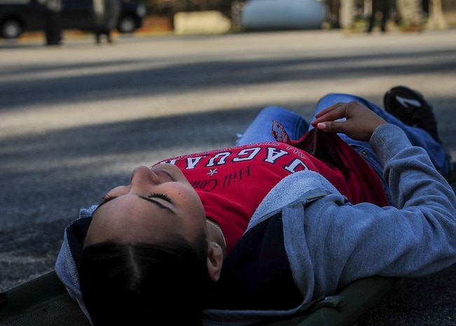 A simulated victim lays waiting for help during a training exercise March 28, 2014, at Joint Base Charleston – Air Base, S.C. First responders from JB Charleston took part in a Mass Casualty Exercise to test the readiness to test the ability of JB Charleston first responders in the event of an emergency. (U.S. Air Force photo / Senior Airman Tom Brading)