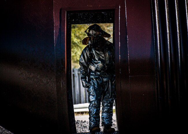 Staff Sgt. Damien Montero, 628th Civil Engineering Squadron fire fighter, looks through the hollowed shell of the simulated aircraft during a training exercise March 28, 2014 at Joint Base Charleston – Air Base, S.C. The training was the Mass Casualty Exercise, and tested first responders’ readiness to take action at a moment’s notice in the event of an emergency. (U.S. Air Force photo / Senior Airman Tom Brading)