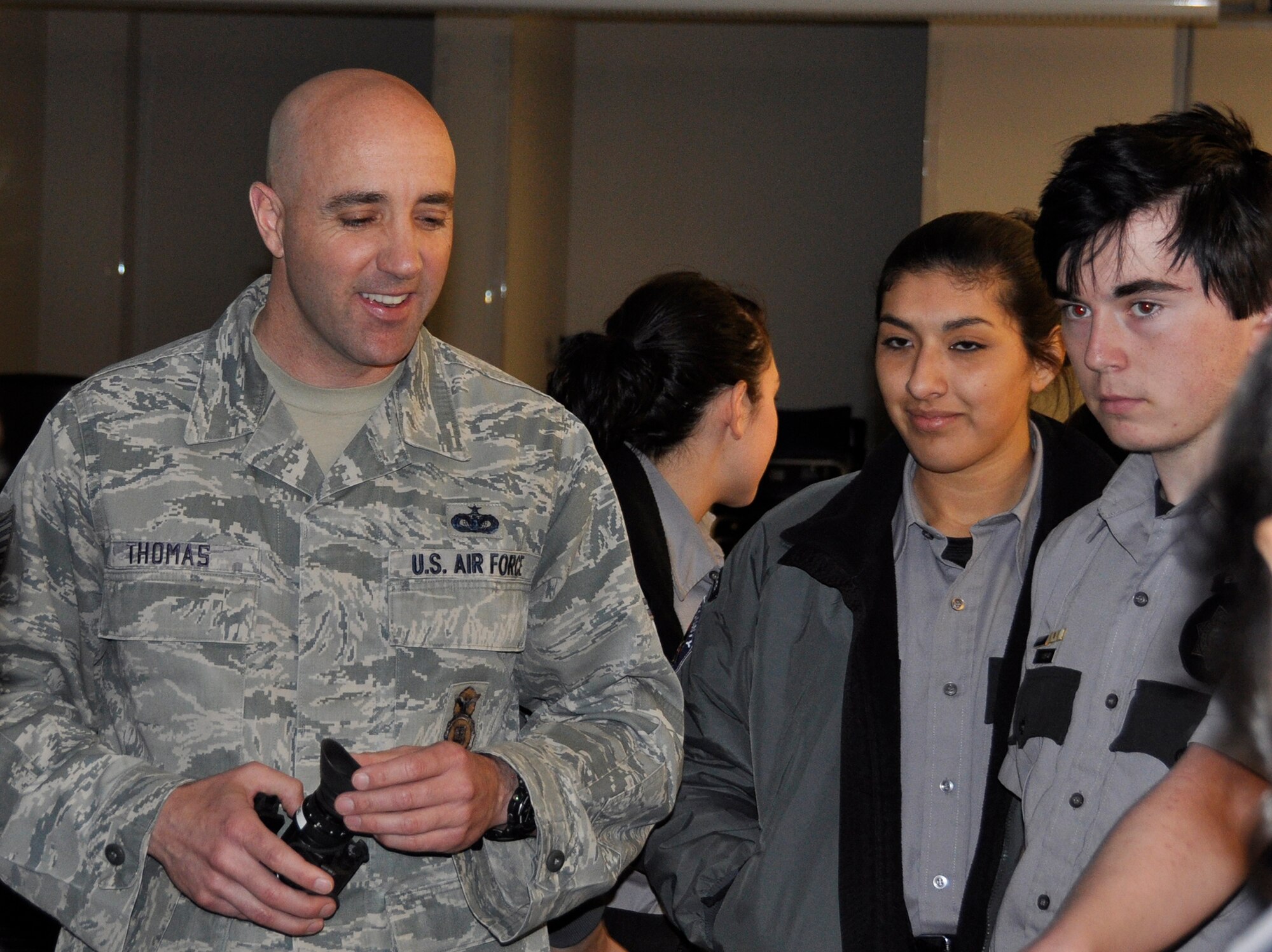 Tech. Sgt. Aaron Thomas shows some of security forces tools of the trade to Pueblo County Sheriff’s Office Explorer Post #157 cadets. The program is intended to give young adults of Pueblo County an opportunity to observe and interact with different aspects of law enforcement. These “Posts” are designed to help the cadets become better citizens and community members. They also give law enforcement members the chance to interact with the community and young adults. Thomas, an Active Guard Reservist, is the noncommissioned officer in charge of training with the 302nd Security Forces Squadron. (U.S. Air Force photo/Master Sgt. Daniel Butterfield)