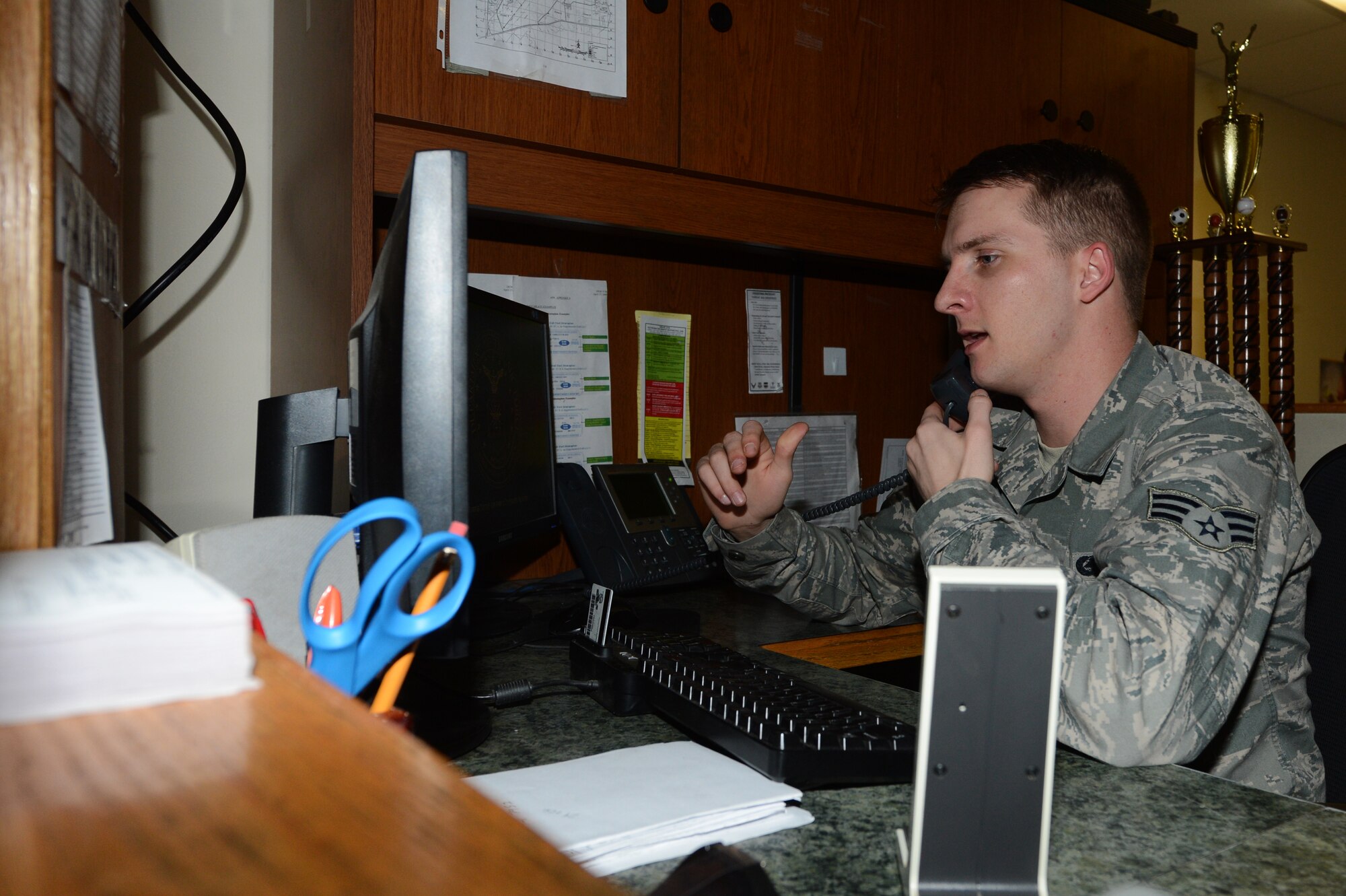U.S. Air Force Senior Airman Joshua Johnson, 20th Logistics Readiness Squadron fuels service center controller, communicates with the maintenance operations center to determine refueling requirements for aircraft on the flightline, Shaw Air Force Base, S.C., March 24, 2014. Johnson, along with the other Airmen who work in the fuels service center help ensure the success of the 20th Fighter Wing mission which is to provide combat ready airpower and Airmen, to meet any challenge, anytime, anywhere. (U.S. Air Force photo by Airman 1st Class Jonathan Bass/Released)