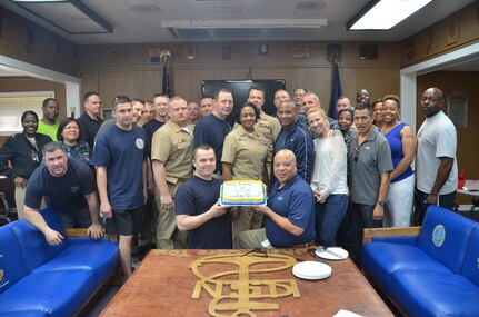 Chiefs, senior chiefs and master chief petty officers from USNS Comfort, join the LowCountry Chief Petty Officer’s Association at Joint Base Charleston – Weapons Station, to celebrate the 221st birthday of the establishment of the chief petty officer rank April 1, 2014. The honors of cutting the cake went to the oldest chief in attendance, retired Master Chief Petty Officer Terry Anthony, (center right), and to the youngest, Chief Petty Officer Eric Reed, a Machinist’s Mate assigned to the Naval Consolidated Brig Charleston. (U.S. Air Force photo/Eric Sesit)