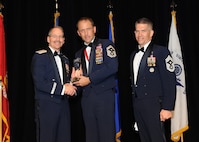 Representing the Air Force for award presentations during the Joint Base San Antonio Annual Awards Banquet March 29 are Brig. Gen. Bob Labrutta, left and Chief Master Sgt. Alex Perry, right. Senior Master Sgt. Jason Hodges, center, from the 37th Training Wing, received the First Sergeant of the Year Award. (U.S. Air Force photo by Melissa Peterson)