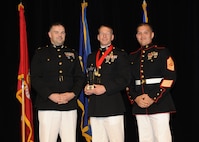 Representing the Marines for award presentations during the Joint Base San Antonio Annual Awards Banquet March 29 are Maj. Martin Gale, left, and Master Sgt. David Villareal, right.  Maj. Andrew Terrel, center, from the 4th Reconnaissance Battalion, received the Company Grade Office of the Year Award. (U.S. Air Force photo by Melissa Peterson)
