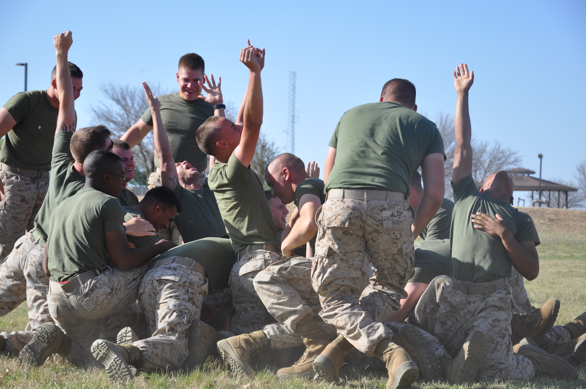 GOODFELLOW AIR FORCE BASE, Texas- Marine Corps Detachment students celebrate a victory during the Barracks Bash here March 28. Ten teams from the detachment formed to compete in five different events, earning points based on scores in each event. The team with the most cumulative points won a month of no room inspections. (U.S. Air Force photo/ Airman 1st Class Erica Rodriguez)