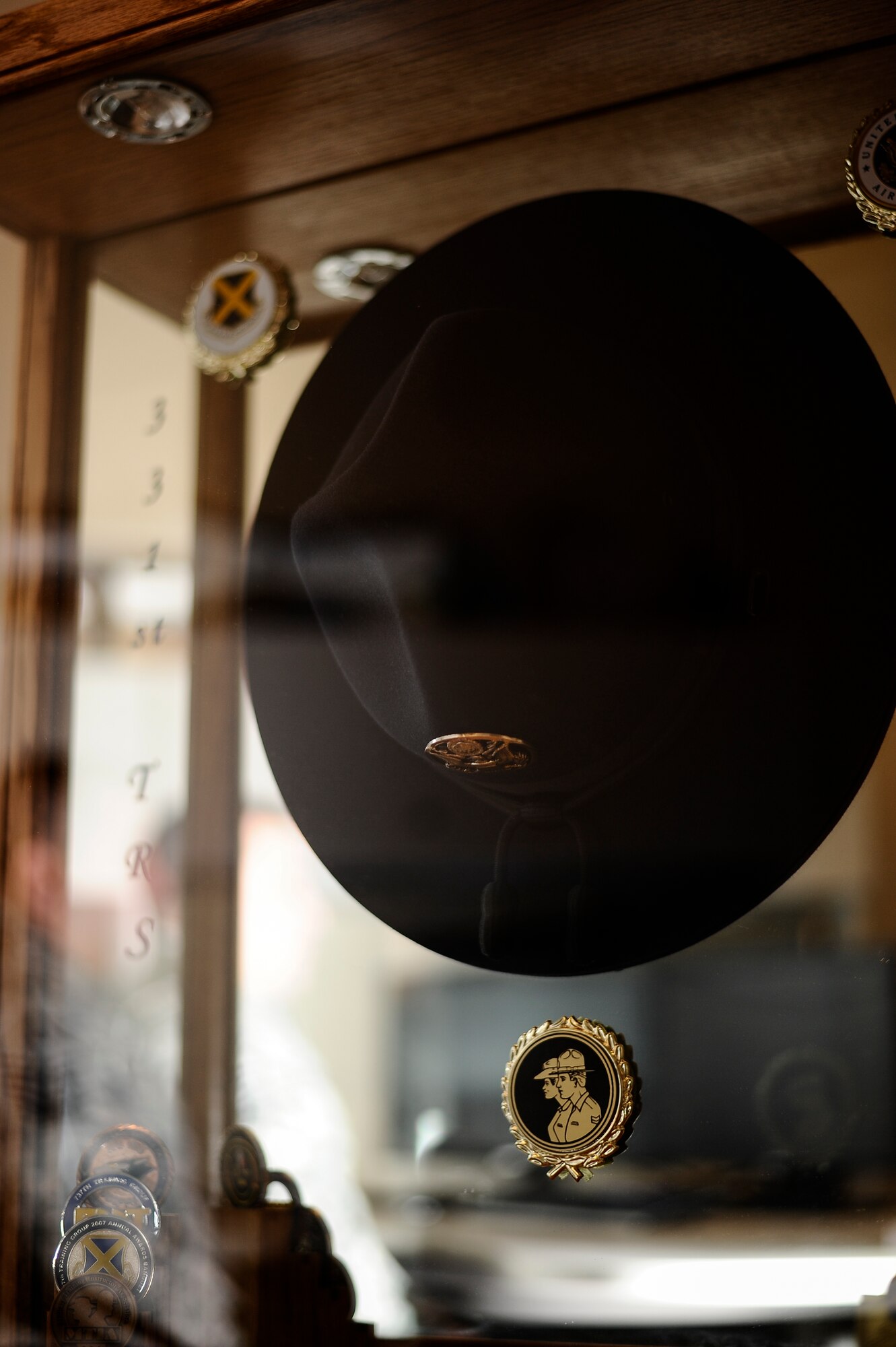 A campaign hat is displayed inside a glass case in Master Sgt. Jesse White’s, 460th Medical Group first sergeant, office March 18, 2014, at the Veterans Affair Joint Venture Buckley Clinic in Denver . White served as an military training instructor for five years before advancing in his career to a first sergeant. (U.S. Air Force photo by Airman 1st Class Samantha Saulsbury/Released)