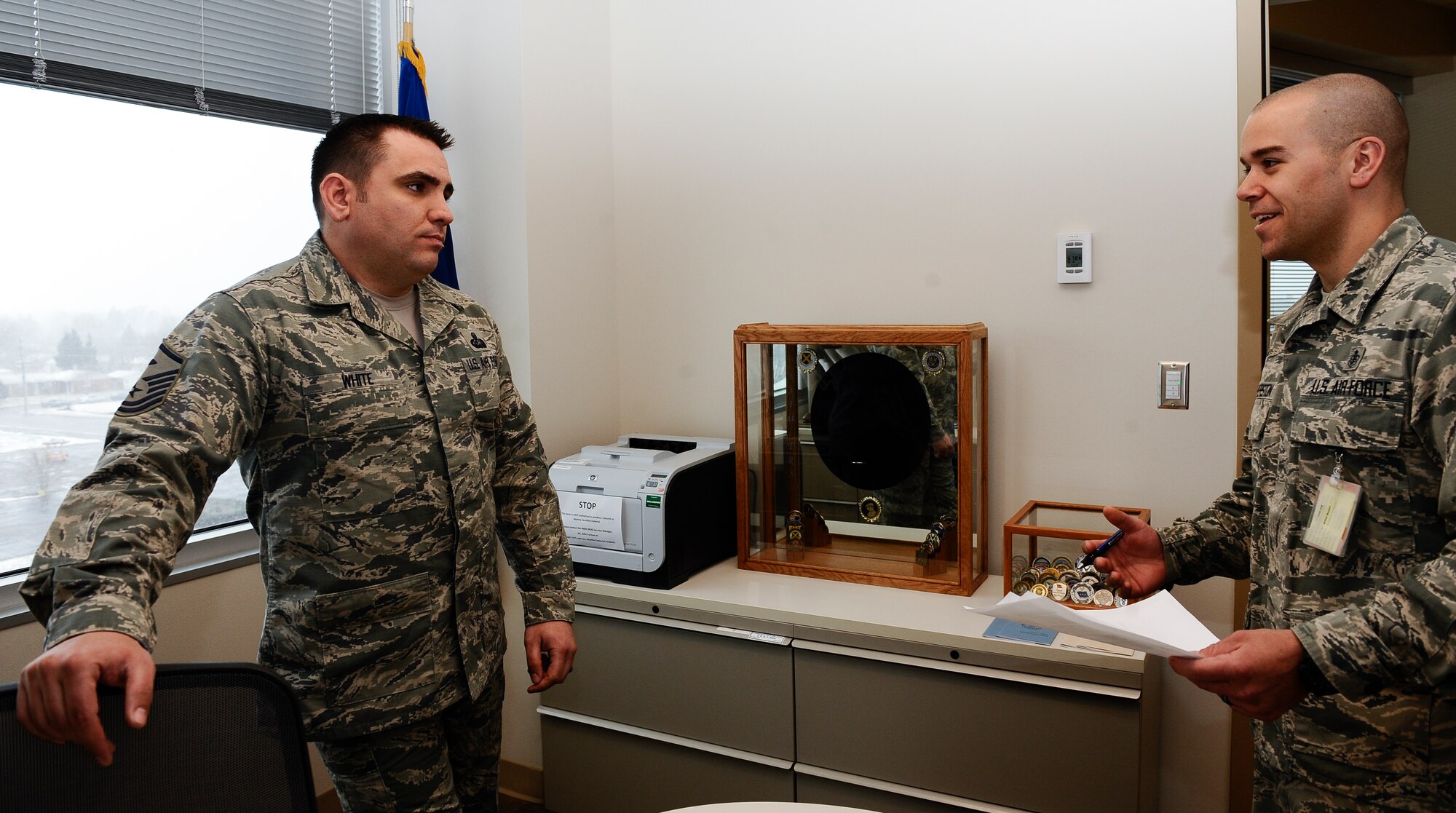 Master Sgt. Jesse White, 460th Medical Group first sergeant, speaks to an Airman March 18, 2014, at the Veterans Affairs Joint Venture Buckley Clinic in Denver. White served as a military training instructor for five years before advancing in his career to a first sergeant. (U.S. Air Force photo by Airman 1st Class Samantha Saulsbury/Released)