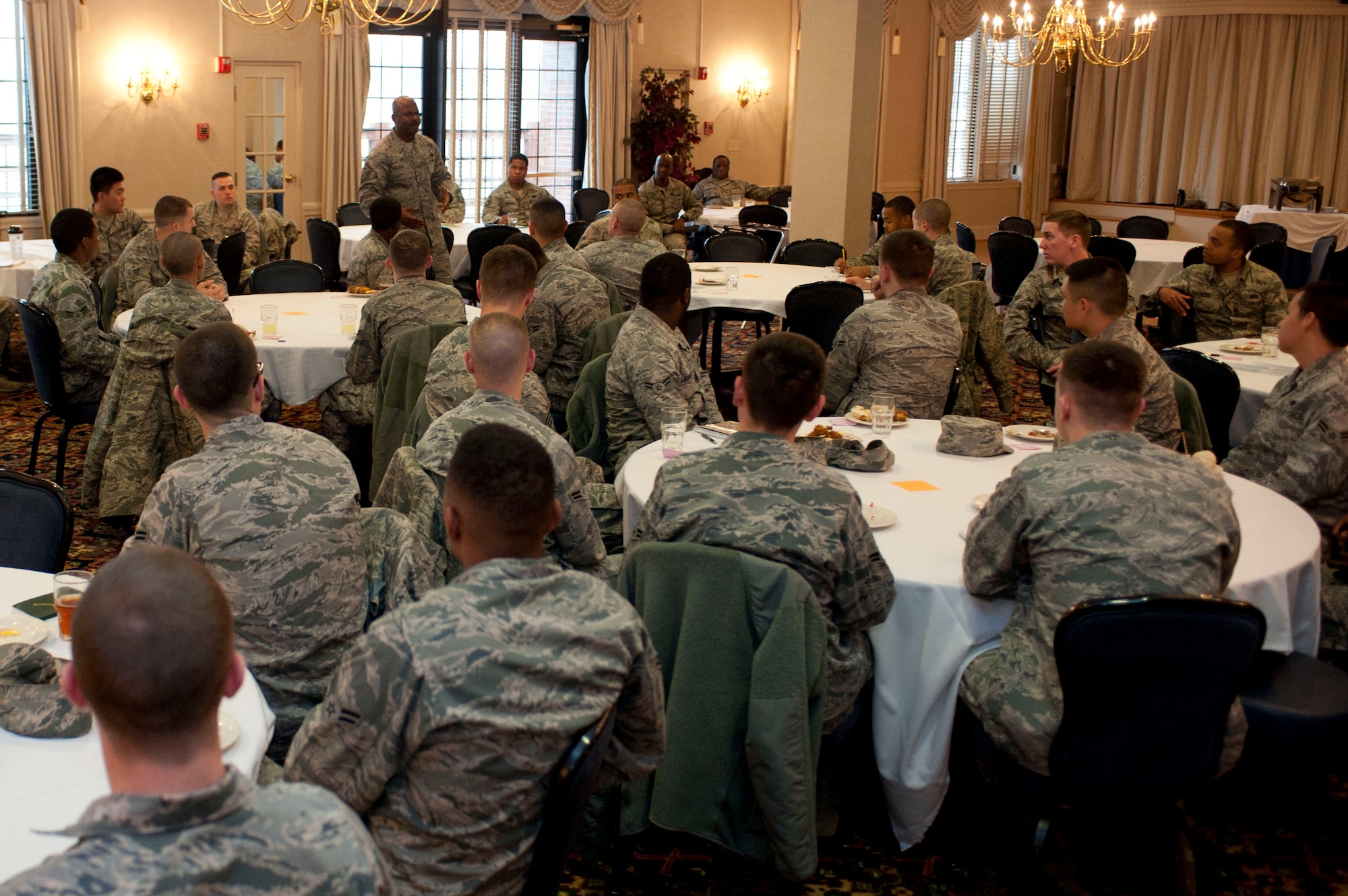 Keeping it Basic attendees listen to guest speakers during the mentoring session at Langley Air Force Base, Va., March 25, 2014. The program reminds Airmen of what they learned in BMT, such as respect, professionalism, discipline and teamwork and continues to build on that foundation. (U.S. Air Force photo by Staff Sgt. Stephanie R. Plichta/Released) 