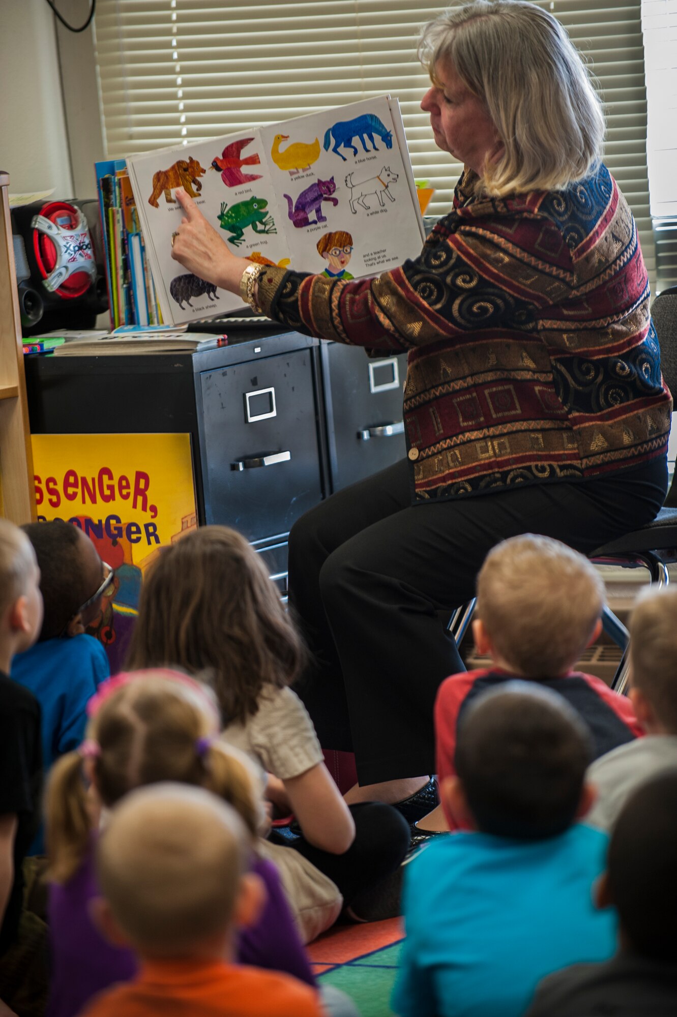 North Dakota’s First Lady Betsy Dalrymple visits kindergarten and second grade students at Minot Air Force Base, March 25, 2014. Dalrymple read a variety of children’s books to the Dakota Elementary School students, while explaining the importance of literature for all ages. (U.S. Air Force photo/Airman 1st Class Lauren Pitts) 