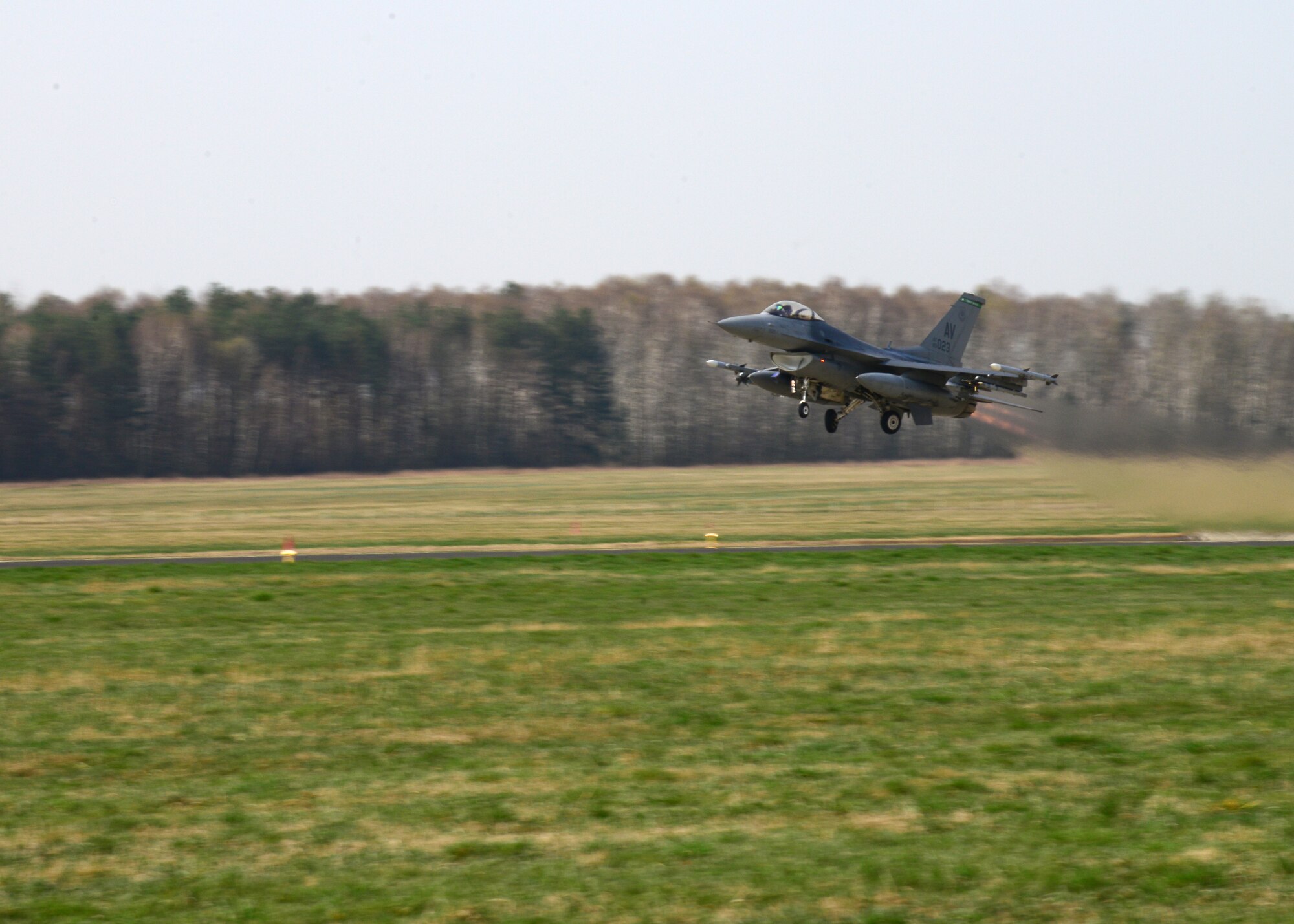 A 555th Fighter Squadron F-16 Fighting Falcon fighter aircraft from Aviano Air Base’s 31st Fighter Wing takes off for a joint-theater training mission with Polish air forces, April 1, 2014, from Łask Air Base, Poland. Poland continues to build its relationship with the U.S. as both nations' air forces integrate their capabilities through training sorties in a joint theater capacity for the first time since the arrival of 31st Fighter Wing aircraft and personnel. (U.S. Air Force photo/Airman 1st Class Ryan Conroy/Released)  