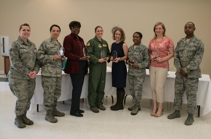 (Left to right) Staff Sgt. Laurie Gutierrez 628th Medical Group, Lt. Col Claudia Bermudez, 628th Logistics Readiness Squadron commander, Florine King, 628th Air Base Wing Sexual Assault Prevention and Response Program Manager, Capt. Jennifer Prouty, 628th Protocol, Lauren Love, wife of 1st Lt. Christopher Love, 628th Public Affairs, Chief Master Sgt. Gigi Manning, 315th command chief, Heidi Wingo, wife of Lt. Col. Joseph Wingo, 628th Communications Squadron commander, and Tech. Sgt. Terrance Whitehead, 628th Logistics Readiness Squadron, pose for a photo after the Women's History Month Luncheon Question and Answer panel March 28, 2013. Women's History Month highlights the contributions of women in history and contemporary society. It is celebrated each March in the United States, the United Kingdom and Australia, corresponding with International Women's Day. (U.S. Air Force photo/Senior Airman Ashlee Galloway)

